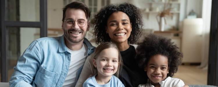 Photo of smiling multi-racial family